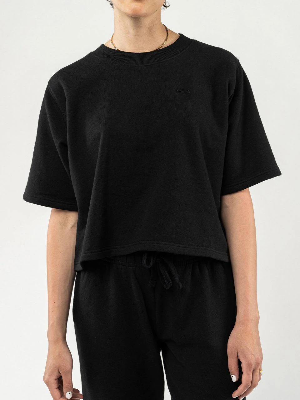 Mela Fairtrade Kurzarm Sweatshirt Deepali Aus Bio-Baumwolle - Schwarz 1 Mela Fairtrade Kurzarm Sweatshirt Deepali Aus Bio-Baumwolle - Schwarz